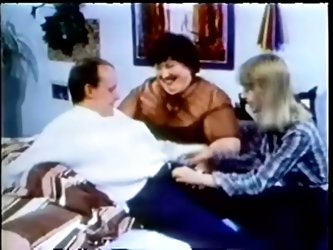 Fat brunette granny Tina enjoys a FFM threesome in retro clip