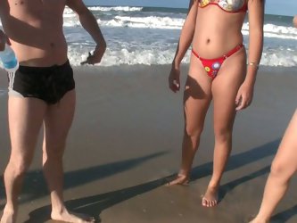 They are walking around looking for some fun or some girls or those two could be combined. Finally they met two girls on a beach. They gonna have a go