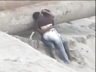 Latino Couple Caught On The Beach
