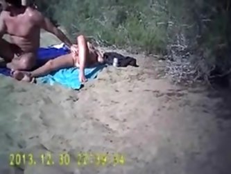 One couple is nude on the dunes in Maspalomas and waiting for someone to help them. More beach sex videos