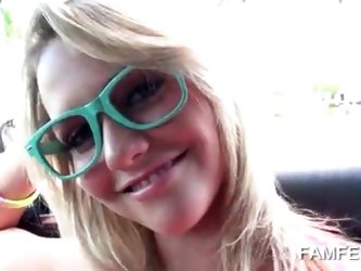 Playful blonde teenie showing perky tits in car