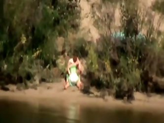 The nasty couple comes down to the river almost every day to fuck. This time I had my camera with me, so I made one hot voyeur video. Amateur babe rid
