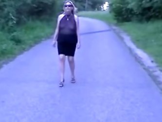 Amateur wife using a see through hot club dress flashing her tits in a public park.