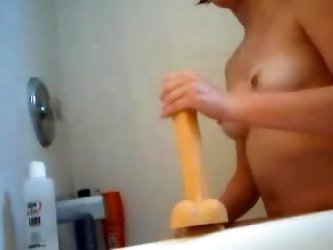 Amateur girlfriend rides dildo toy in the bathroom