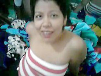 Lovely and somewhat plump Mexican amateur wife in black pants and cute pink striped t-shirt gives a modest BJ to her husband on their bed. Her excitem